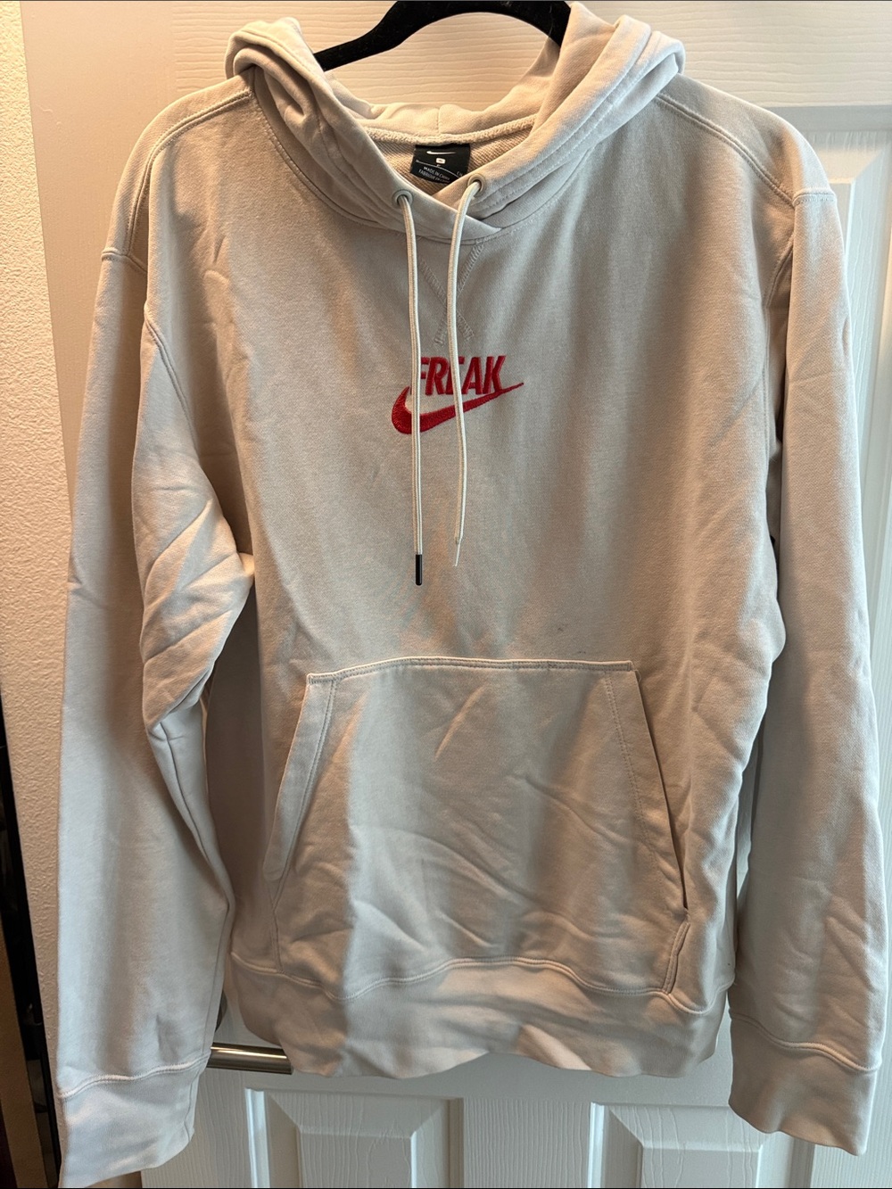 Nike Men's Beige Hoodie with Red 'FREAK' Logo